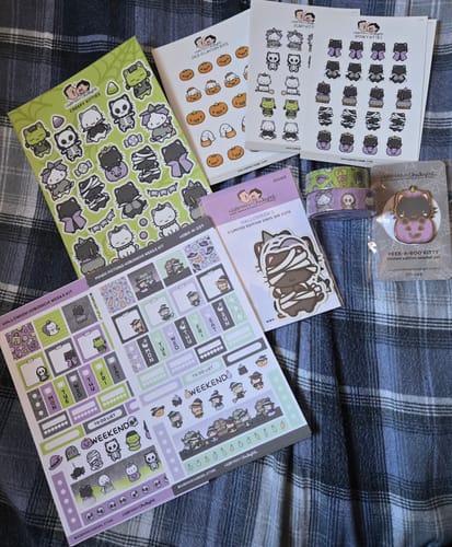 Customer's Magic Potions Theme Hobonichi Weeks Kit and other sticker sheets from the collection displayed on a plaid blanket.