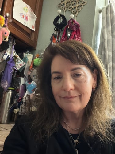 Reviewer's selfie showing her glowing skin after using the Grass Fed Tallow & Honey Balm.