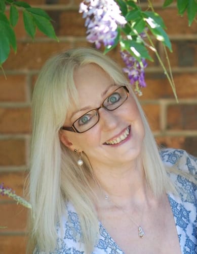 Reviewer smiling, showing glowing skin after using the Sea Buckthorn Serum.