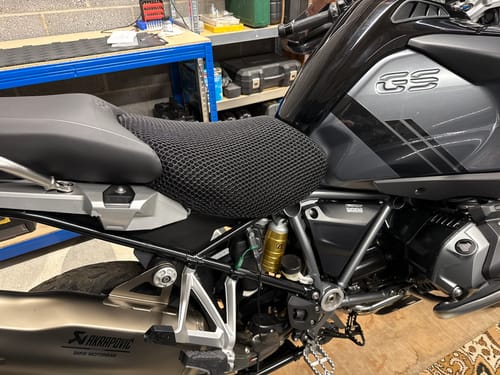 Customer's black mesh Wind Rider Seat Cover installed on their motorcycle, showing a snug and perfect fit.