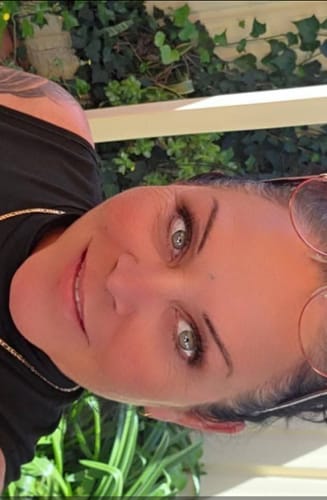 Close-up of a smiling reviewer with clear, hydrated skin after using the Sea Buckthorn Serum.