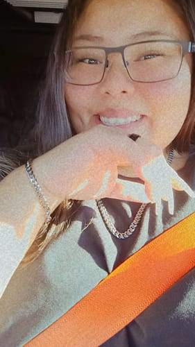 Customer selfie showing off their shiny Cuban Link Bracelet and matching necklace.