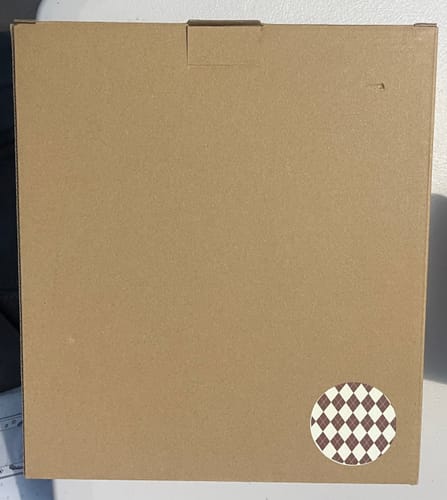 Packaging for the customer's MYSTERY B-GRADE BINDER, a plain box with an argyle sticker on the corner.