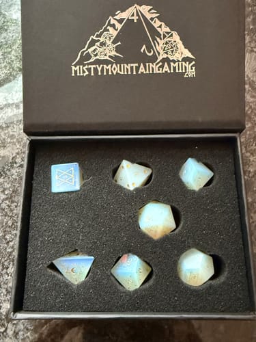 Customer's Spellcaster Opalite Stone Dice Set displayed in its padded black storage box with the lid open.