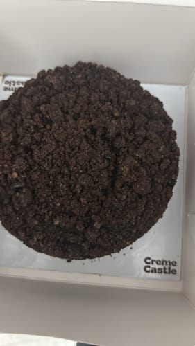 Customer's Sugar Free Chocolate Banana Tea Cake with a dark crumble topping inside its open box.