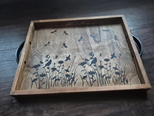 Customer's wooden serving tray with a burned design of flowers and birds, made with the Wood Pre-Treatment.