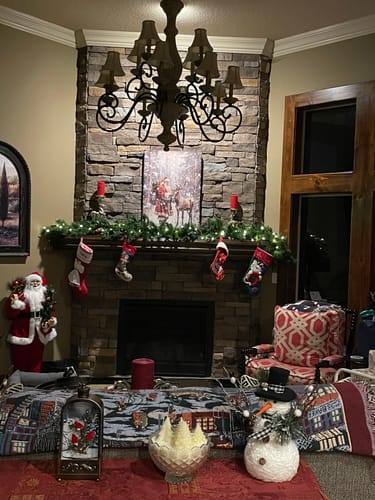 Customer's beautiful Tailored Boost print displayed on a stone fireplace mantel among Christmas decorations.
