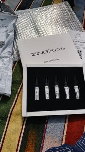 Customer's Best selling Tester Pack open, showing five perfume samples neatly arranged in a white branded box.
