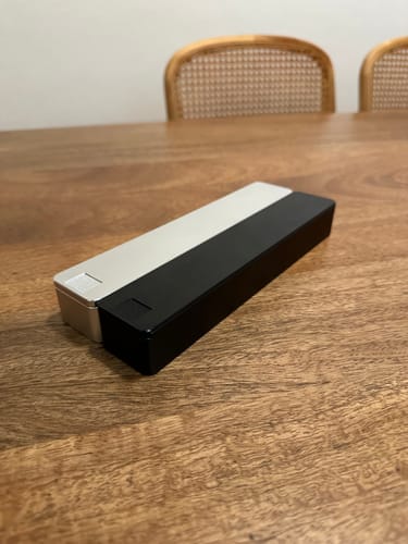 Customer's two-tone Weekly AM-PM Vitamin Case 2.0 shown connected on a wooden table.