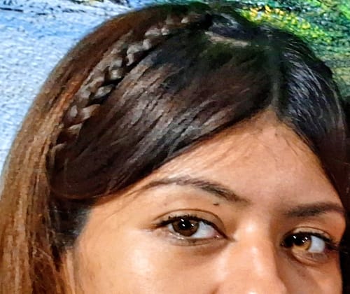 Close-up of a reviewer wearing Faylinn Skylark Brown contacts, which give her eyes a natural, honey color.