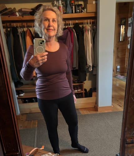 Customer wearing the slim-fitting Remi Long Sleeve T Shirt in Grape Harvest.