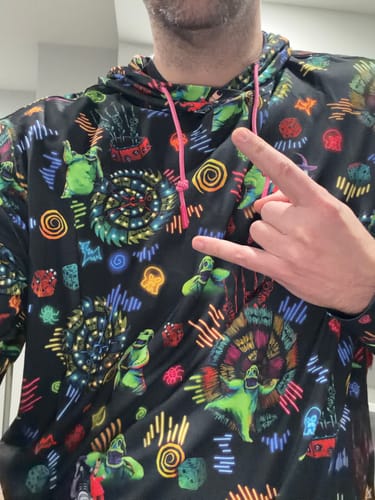 Customer wearing the Oogie's Turn to Boogie hoodie, showing the detailed, colorful all-over print.