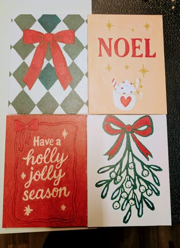 Customer's four completed mini paintings from the Merry Christmas Set, showing various festive designs and quotes.