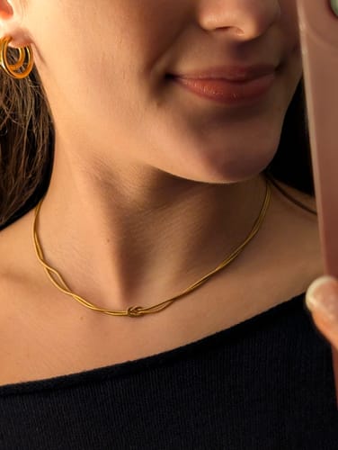 Reviewer wearing the Knotted Gold Chain Necklace in a close-up selfie.