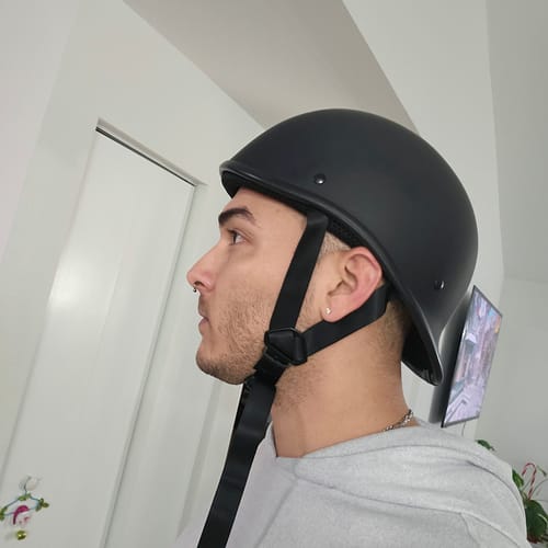 Reviewer's side profile wearing the low-profile, black Polo Switchback Helmet.