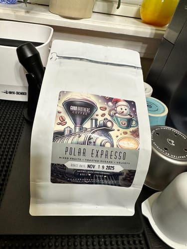 Customer's bag of Polar Expresso Blend coffee with its festive illustrated label on a kitchen counter.