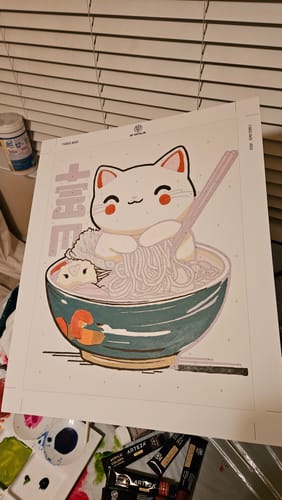 Reviewer's Happy Japanese Cat paint-by-numbers canvas in progress, with the bowl section painted a solid teal color.