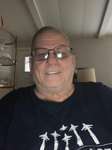 Reviewer's submitted portrait photo, taken indoors.