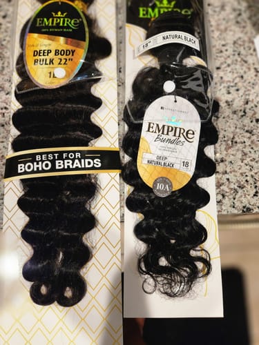 Customer's two packages of Sensationnel Empire Bundles hair weave in a black deep wave style.