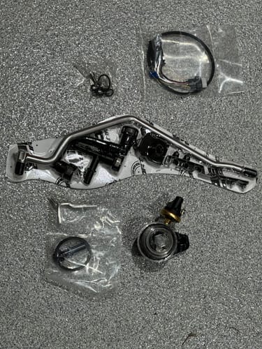 Customer's complete SPE Disaster Prevention Kit with the metal line and transparent filter laid out before installation.