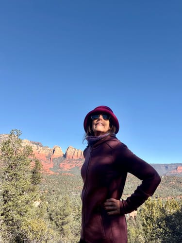 Reviewer hiking in the warm Cubby Hooded Sweatshirt in the Grape Harvest color.