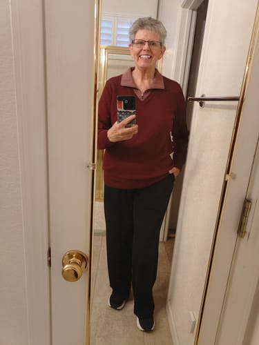 Reviewer wearing the black Bree Lounge Pants, showing the full-length, straight-leg fit in a mirror.