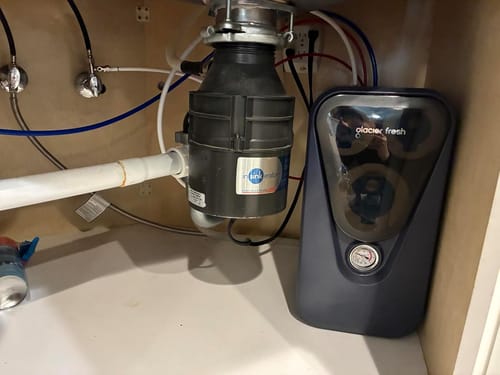 Customer's Glacierfresh U03 RO system installed in a cabinet under a sink, showing its compact, space-saving design.