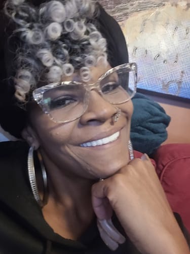 Customer showing a bright, confident smile with their new Pop On Veneers.