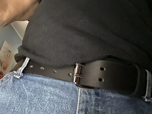 Close-up of a reviewer wearing the black Legend Double Prong Retro Style belt with a pair of blue jeans.