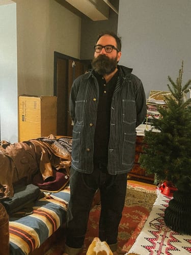 Reviewer wearing the pinstriped 1936 98-J Railroad Work Denim Jacket indoors.