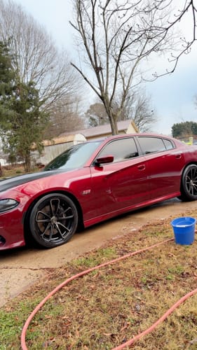 Reviewer's shiny red Dodge Charger after being dried with the detailing towel, leaving a streak-free finish.