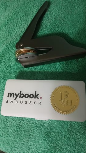 Customer photo review of My Book Embosser – Custom Book Embosser