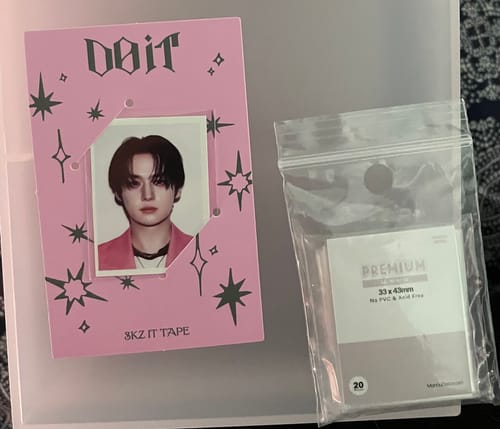 Customer shows the packaging for PREMIUM MINI ID SLEEVES next to a K-pop ID photo holder.