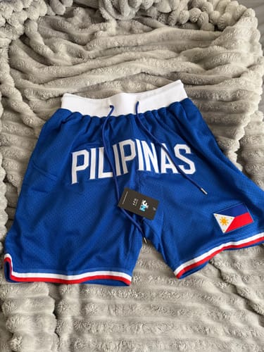 Customer's new blue Philippines Heritage Basketball Shorts laid flat, showing the embroidered lettering and flag patch.