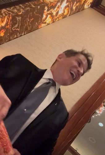 Reviewer laughing, showing smooth skin after using The Micro Infusion System.