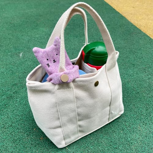 Customer photo review of Hugging Cat Bag Charm & Earphone Case