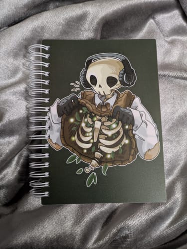 Customer photo review of Chilling Skeleton with Fireflies Small Reusable Sticker Book
