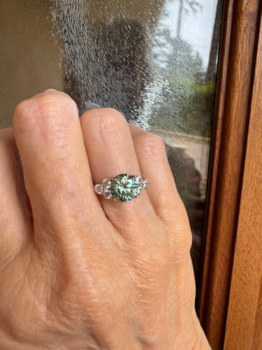 Customer photo review of Green Moissanite Side Stone Engagement Ring