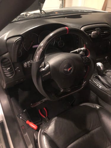 Customer photo review of Genuine Carbon Fiber Steering Wheel With Button Trim For C6 Corvette 2006-2011