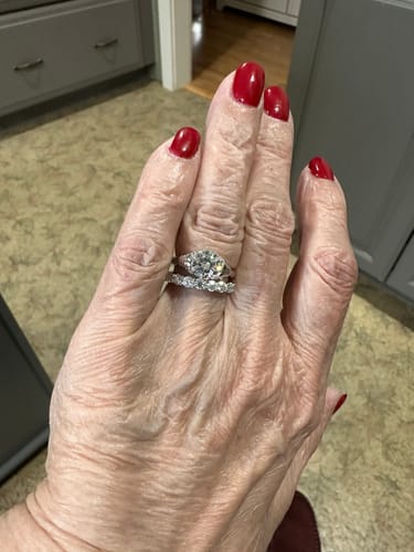 Customer photo review of Solitaire Round Moissanite Stepped Half Bezel Engagement Ring