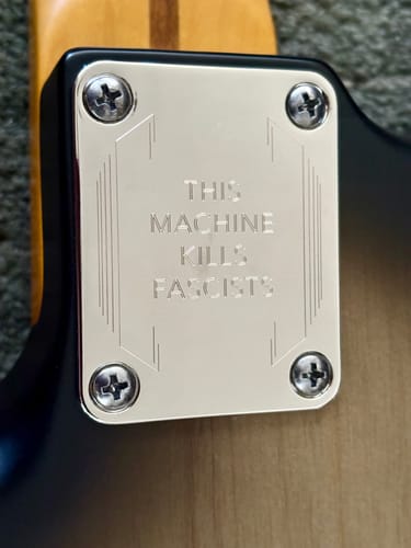 Customer photo review of THIS MACHINE KILLS FASCISTS - Engraved Neckplate - Nickel
