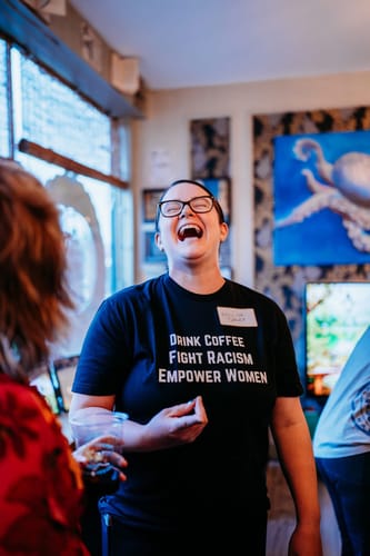 Customer photo review of Drink Coffee Empower Women Unisex T-shirt