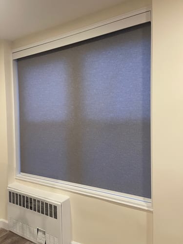 Customer photo review of SmartWings Motorized Light Filtering Roller Shades 70% Blackout Safari