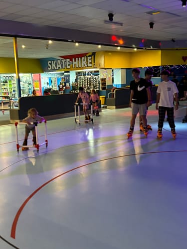 Customer photo review of Kids Adjustable Roller Skates with different sizes and multiple colours