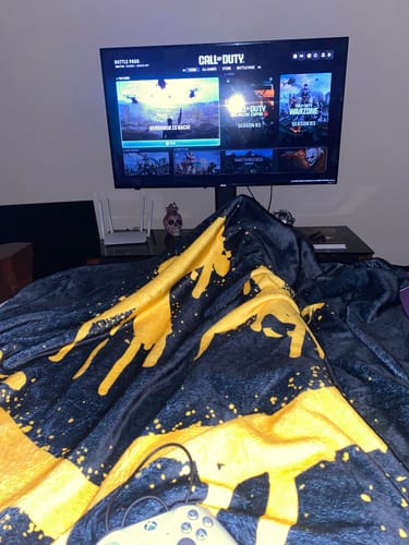 Customer photo review of Smiley Vybes Velveteen Plush Blanket
