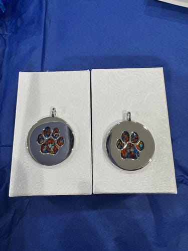 Customer photo review of Pawprint Disc Pendant with Cremation Ashes