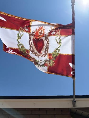 Customer photo review of New! Flag of the Sacred Heart – Red – Indoor/outdoor Flag – Polyester – 3x5 and 4x6.