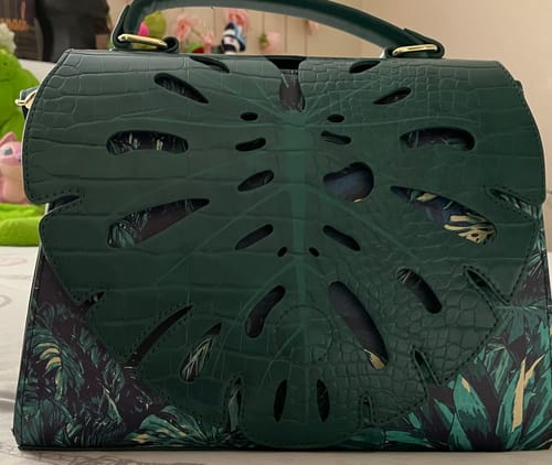 Customer photo review of Loungefly Jurassic World Jungle Velociraptor Glow Crossbody Bag