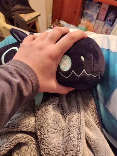 Customer photo review of Rain World - Glowing Cyan Lizard Plush