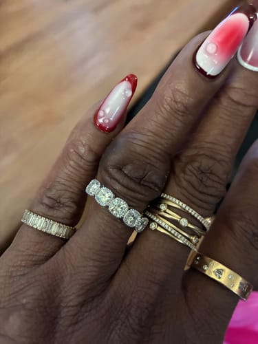 Customer photo review of DovEggs Silver & Platinum Celebration Group order cushion bezel five stone moissanite wedding band